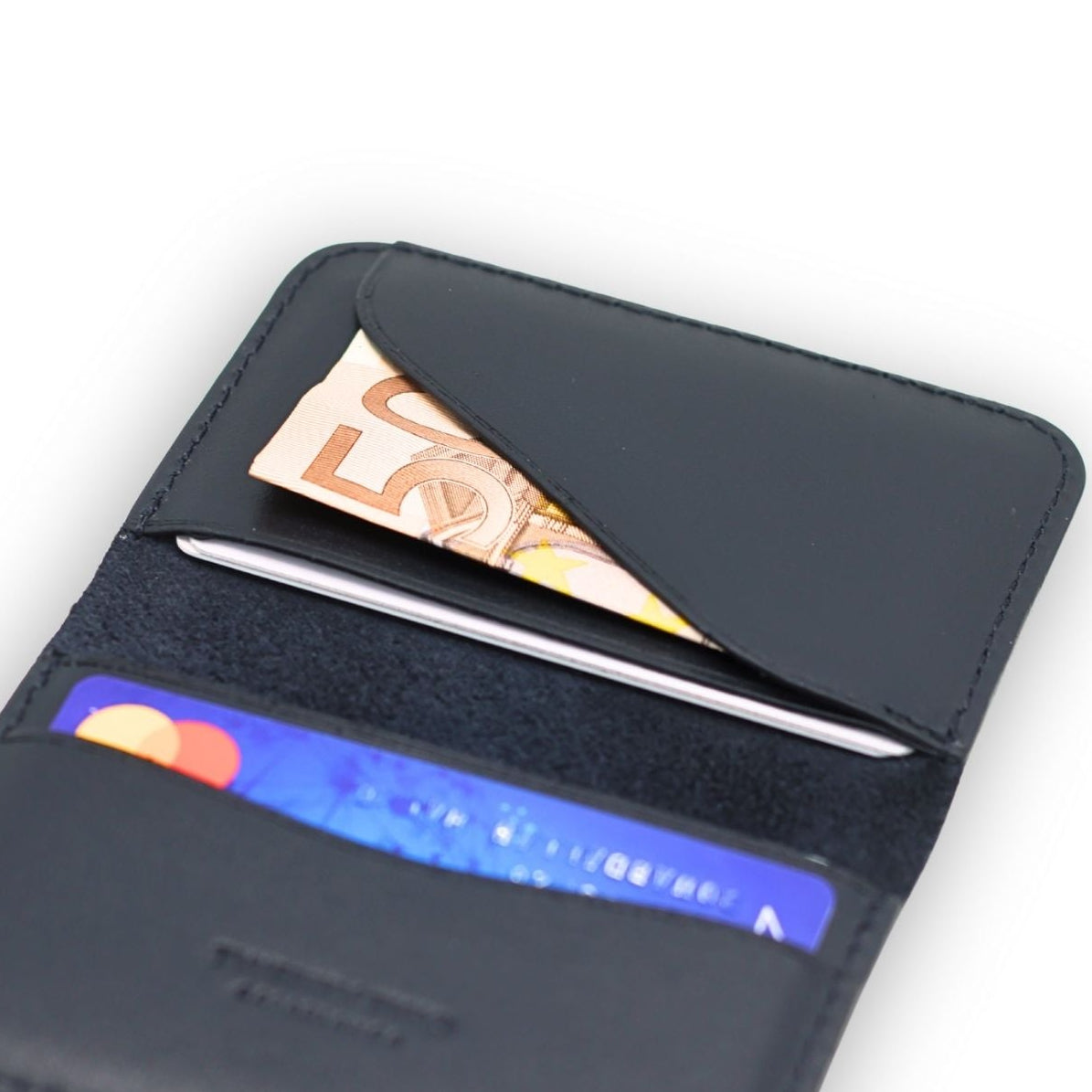 Black leather wallet with cards and cash on a white background